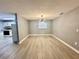 Living room features wood-look floors and view to the kitchen at 4535 Weston Ct, Bartow, FL 33830
