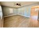 Spacious living room with modern flooring and a ceiling fan at 4535 Weston Ct, Bartow, FL 33830