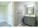 Bathroom featuring a gray vanity, a neutral wall color, and tiled floor at 4629 Harden Blvd, Lakeland, FL 33813