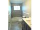 Updated bathroom with shower-tub combo, modern vanity, gray tile and neutral color scheme at 4629 Harden Blvd, Lakeland, FL 33813