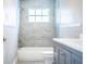Updated bathroom featuring modern vanity, tile flooring and a tiled shower and tub at 4629 Harden Blvd, Lakeland, FL 33813