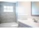 Updated bathroom featuring modern vanity, tile flooring and a tiled shower and tub at 4629 Harden Blvd, Lakeland, FL 33813