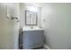 Bathroom featuring a gray vanity, a neutral wall color, and tiled floor at 4629 Harden Blvd, Lakeland, FL 33813