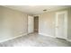 Bedroom featuring large windows, neutral walls, and light-toned floors, perfect for a calming retreat at 4629 Harden Blvd, Lakeland, FL 33813