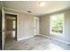 Inviting bedroom with light-filled windows and trendy vinyl floors, creating a serene living space at 4629 Harden Blvd, Lakeland, FL 33813