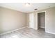 Inviting bedroom featuring tile floors, a closet, and a light neutral wall color at 4629 Harden Blvd, Lakeland, FL 33813