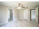 Large bedroom with ceiling fan, neutral walls, and vinyl floors, offering a comfortable living area at 4629 Harden Blvd, Lakeland, FL 33813