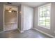Bedroom featuring tile floor and a large window with views of the yard at 4629 Harden Blvd, Lakeland, FL 33813