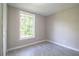 Bedroom features a large window providing natural light and tiled flooring at 4629 Harden Blvd, Lakeland, FL 33813