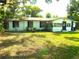 Charming single-story home featuring a neatly landscaped front yard and a welcoming entrance at 4629 Harden Blvd, Lakeland, FL 33813