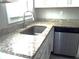 Close-up of kitchen counter featuring granite countertops and stainless steel appliances at 4629 Harden Blvd, Lakeland, FL 33813