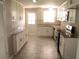 Well-lit kitchen with white cabinets, granite countertops, and stainless steel appliances at 4629 Harden Blvd, Lakeland, FL 33813