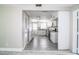 Bright kitchen featuring white cabinets, stainless steel appliances, gray tile flooring, and granite countertops at 4629 Harden Blvd, Lakeland, FL 33813