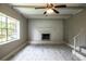 Bright living room with a brick fireplace and a ceiling fan at 4629 Harden Blvd, Lakeland, FL 33813