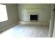 Living room featuring a white brick fireplace and contemporary flooring at 4629 Harden Blvd, Lakeland, FL 33813