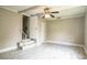 Living room features a ceiling fan, stairs to an upper level, and access to other rooms at 4629 Harden Blvd, Lakeland, FL 33813