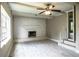 Bright living room with a brick fireplace and a ceiling fan at 4629 Harden Blvd, Lakeland, FL 33813