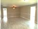 Bright living room with neutral walls, ceiling fan and modern flooring at 4629 Harden Blvd, Lakeland, FL 33813