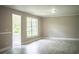 Spacious living room featuring marble floors, and natural light from the large windows at 4629 Harden Blvd, Lakeland, FL 33813