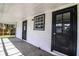 This features a cozy porch with two doors and a window allowing natural light to stream in at 4629 Harden Blvd, Lakeland, FL 33813