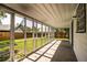 Screened-in porch featuring concrete floor, a white ceiling, and views of the backyard at 4629 Harden Blvd, Lakeland, FL 33813