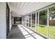 Screened in porch featuring concrete floor, a white ceiling, and natural light at 4629 Harden Blvd, Lakeland, FL 33813