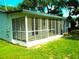 Enclosed screened porch, perfect for enjoying the outdoors in comfort and style at 4629 Harden Blvd, Lakeland, FL 33813