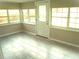 Bright sunroom with tile flooring and ample natural light from surrounding windows at 4629 Harden Blvd, Lakeland, FL 33813