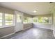 Bright sunroom featuring tile floors and large windows for natural lighting at 4629 Harden Blvd, Lakeland, FL 33813