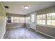 Bright sunroom with lots of windows for natural light and stylish tile flooring at 4629 Harden Blvd, Lakeland, FL 33813