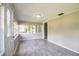 Cozy sunroom featuring tile floors and lots of bright, natural light at 4629 Harden Blvd, Lakeland, FL 33813