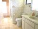 Bathroom featuring a vanity, toilet, and shower with glass door at 5070 Ironwood Trl, Bartow, FL 33830