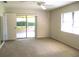 Bedroom with sliding glass doors to an outdoor patio at 5070 Ironwood Trl, Bartow, FL 33830