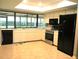 Bright kitchen with tile flooring, modern appliances, and ample counter space at 5070 Ironwood Trl, Bartow, FL 33830