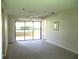 Spacious living room with sliding doors to outdoor patio at 5070 Ironwood Trl, Bartow, FL 33830