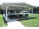 Community pavilion featuring picnic tables, grills and access to tennis and basketball courts at 5070 Ironwood Trl, Bartow, FL 33830
