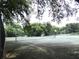 Community tennis court providing recreational opportunities for residents at 5070 Ironwood Trl, Bartow, FL 33830
