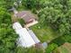 Aerial view of the house showing the surrounding yard and outbuildings at 5120 Lunn Rd, Lakeland, FL 33811