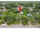 Arrowed aerial view of home with swimming pool, garage, and fenced backyard at 5120 Lunn Rd, Lakeland, FL 33811