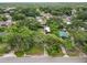 Aerial view of a neighborhood featuring tree-lined streets and single-Gathering homes at 5120 Lunn Rd, Lakeland, FL 33811