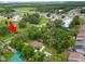Property arrowed, surrounded by lush greenery near neighborhood and roads at 5120 Lunn Rd, Lakeland, FL 33811
