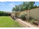 Exterior showing a lovely covered patio, garden beds, and lawn at 5120 Lunn Rd, Lakeland, FL 33811