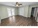 Spacious bedroom features wood-look flooring and access to the backyard at 5120 Lunn Rd, Lakeland, FL 33811