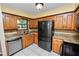 Well-lit kitchen with stainless steel appliances and granite countertops at 5120 Lunn Rd, Lakeland, FL 33811