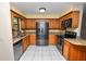 Well-equipped kitchen boasting stainless steel appliances, granite countertops, and ample cabinet space at 5120 Lunn Rd, Lakeland, FL 33811