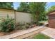 Beautiful landscaping with a stone paver walkway, colorful flowers, and lush greenery at 5120 Lunn Rd, Lakeland, FL 33811