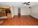 Hardwood floors, ceiling fan, and seamless access to the kitchen at 5120 Lunn Rd, Lakeland, FL 33811