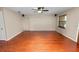 Neutral living room featuring hardwood floors, ceiling fan, windows, and recessed lighting at 5120 Lunn Rd, Lakeland, FL 33811