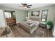 Cozy bedroom with a plush bed, tiled floors, an ensuite bathroom, and natural light at 5120 Lunn Rd, Lakeland, FL 33811