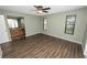Spacious main bedroom with wood-look flooring and ensuite bathroom at 5120 Lunn Rd, Lakeland, FL 33811